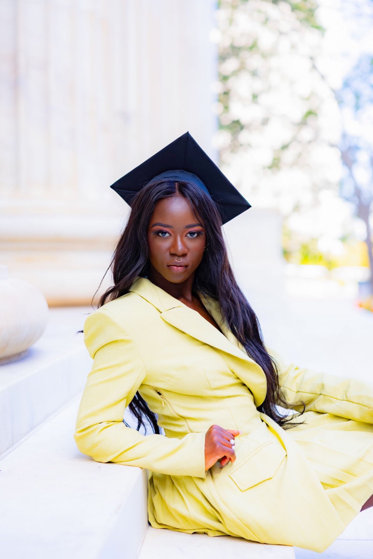 Graduation portrait seated on marble steps