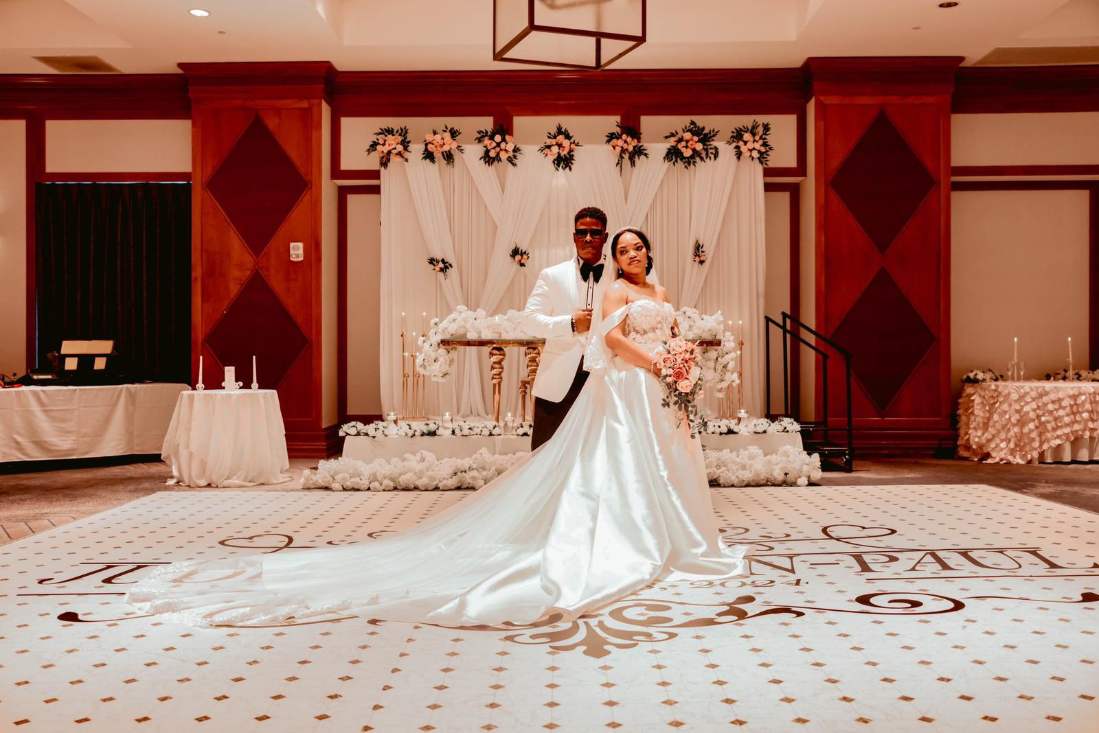 Bride and groom in the empty ballroom before the reception