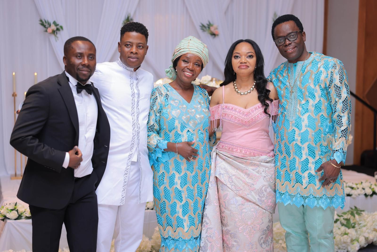 Family portrait with the couple at the reception